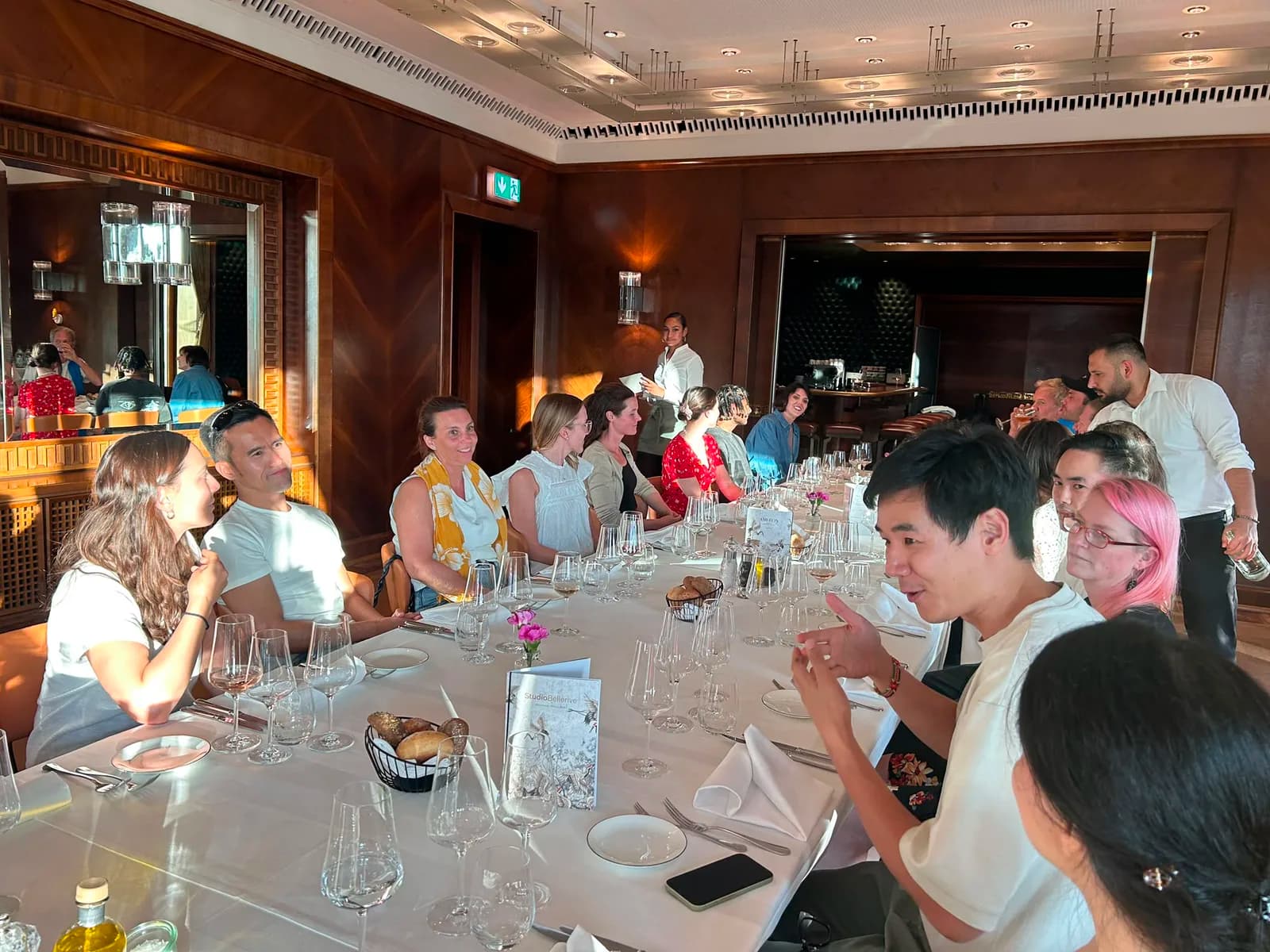 Participants around a long dinner table at the closing dinner in Zurich