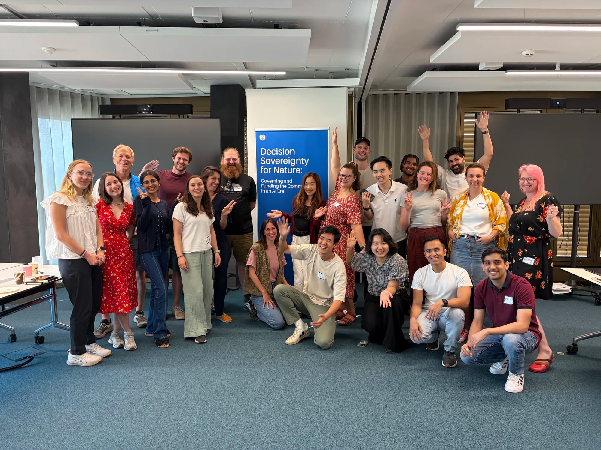 Workshop participants in front of the Decision Sovereignty for Nature banner at the ETH AI Center