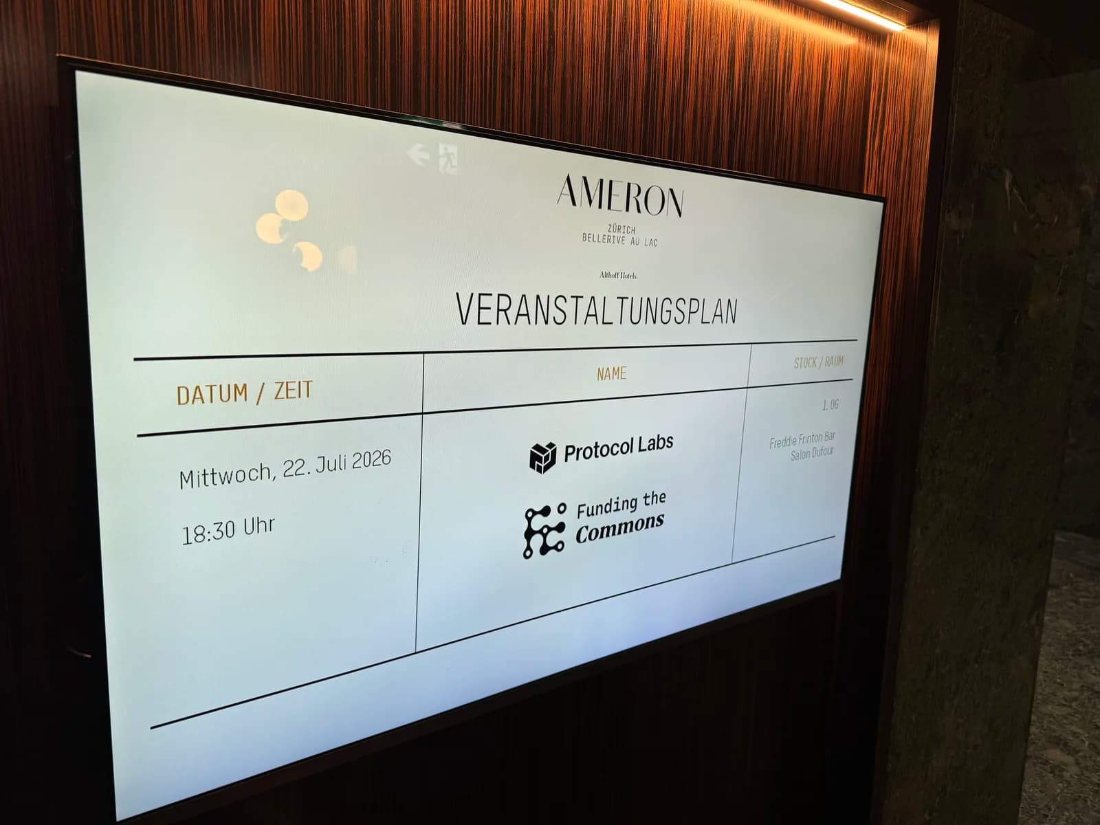 Hotel event board listing Protocol Labs and Funding the Commons for the evening programme